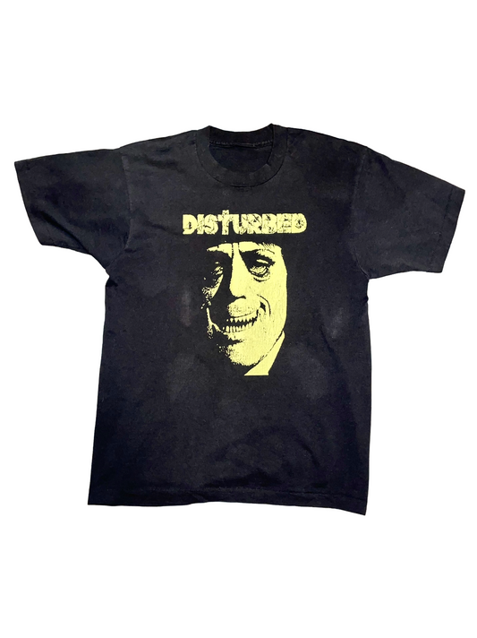 Black t-shirt with yellow graphic and 'DISTURBED' text on a white background