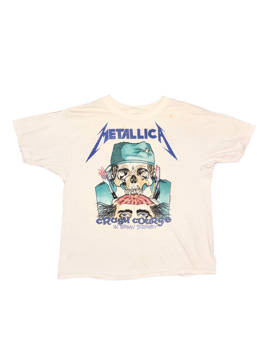 Beige t-shirt with Metallica graphic design by Pushead on a white background