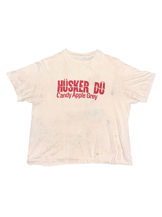Grey t-shirt with red "Husker Du" text on a white background