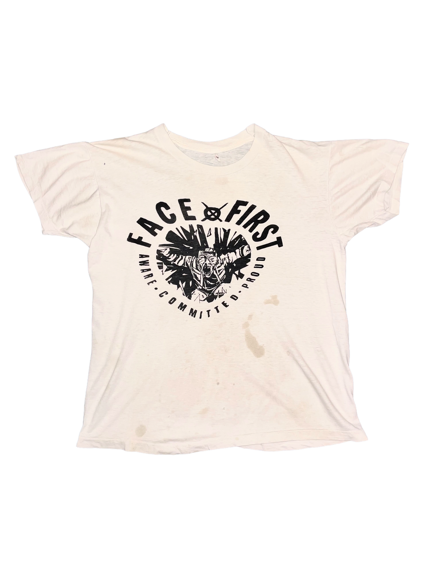 Beige t-shirt with black "Face First" graphic design and text on a white background